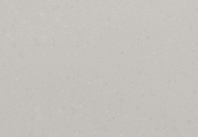 Light gray, textured quartz countertop surface.