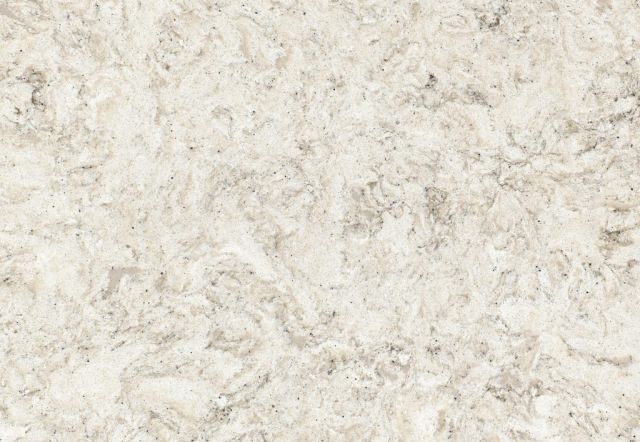 Beige and white stone countertop with mottled patterns.