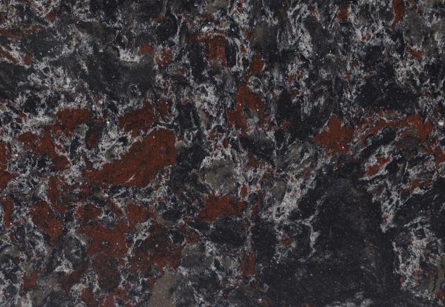 Dark countertop with black, white, and reddish-brown veining.