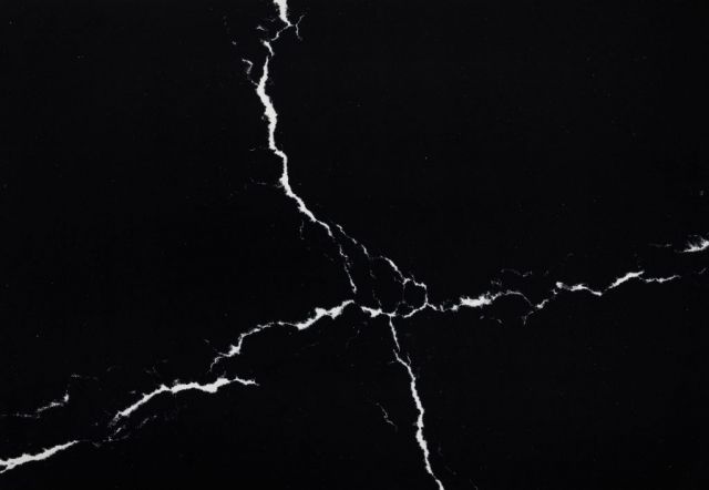 Black countertop with white veining.