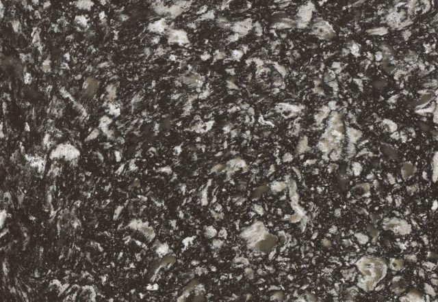 Close-up of a dark granite countertop with white and gray flecks.