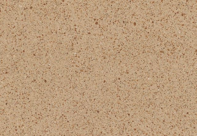 Tan quartz countertop surface with speckled pattern.