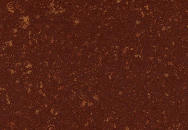 Dark brown, textured surface with flecks of lighter brown and tan.