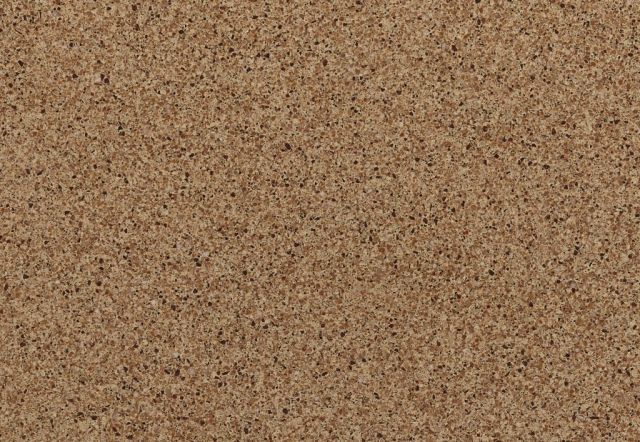 Close-up of a tan corkboard surface with a grainy, textured appearance.