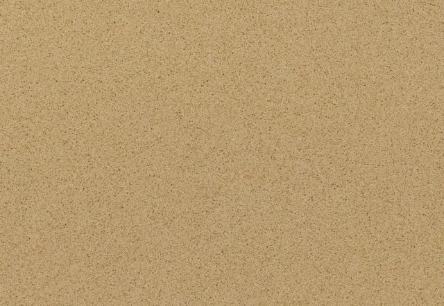 Close-up of a uniformly textured, tan surface with small, dark flecks.