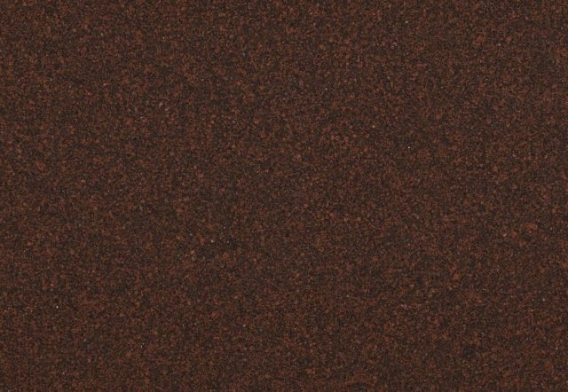 Dark brown, textured surface; appears to be carpet or fabric.