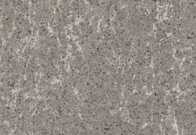 Gray quartz countertop with speckled texture and white veining.