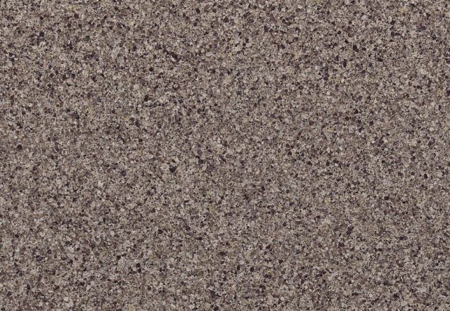 Textured, speckled brown surface, likely granite or stone.