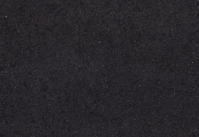 Dark gray, grainy textured surface.