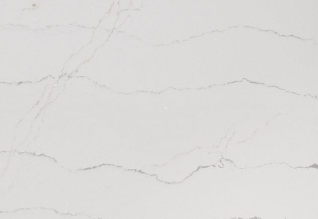 White countertop with subtle gray veining.