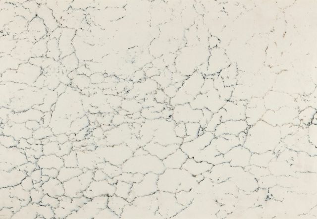 Creamy white surface with delicate grey veining, resembling marble.