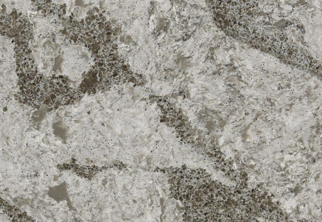 White and gray quartz countertop with marbled, speckled patterns.