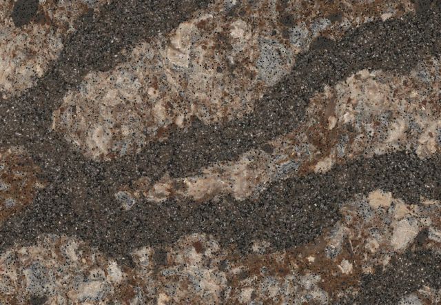 Close-up of a mottled stone countertop with swirling dark brown and beige patterns.