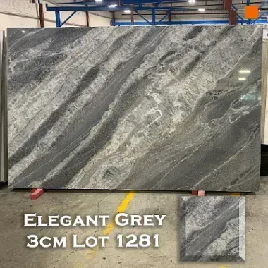 Elegant Grey granite slab, 3 cm thick, with flowing gray and white veining, displayed in a warehouse.