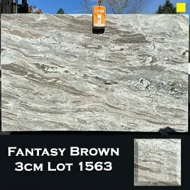 Fantasy Brown granite slab with brown, gray, and white swirls.