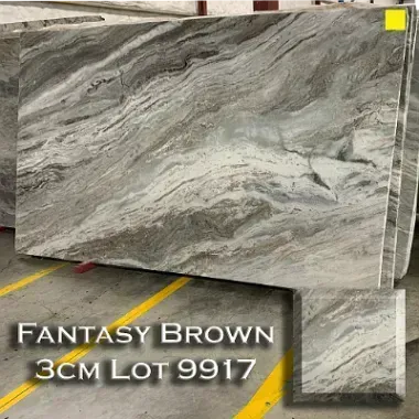 Fantasy Brown marble slab with swirling brown, white, and gray patterns.