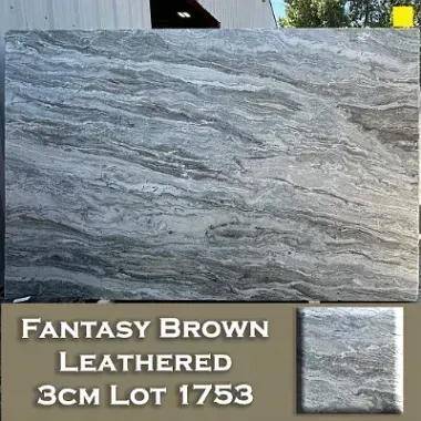 Fantasy Brown Leathered stone slab with gray and brown veining, sample tile on right.