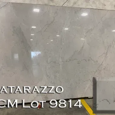 Large light gray stone slab with subtle veining. Includes sample piece, labeled .