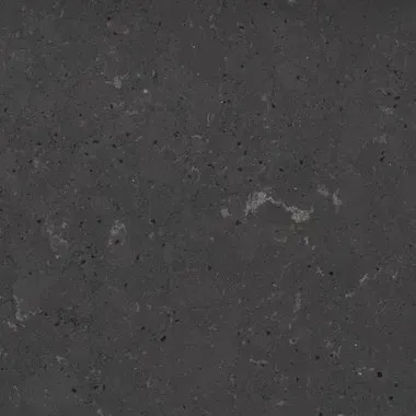 Dark gray stone surface with small flecks and subtle variations.