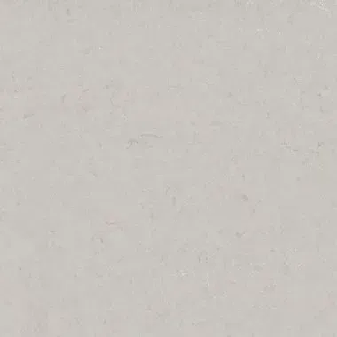 Off-white stone surface with subtle variations in texture and color.