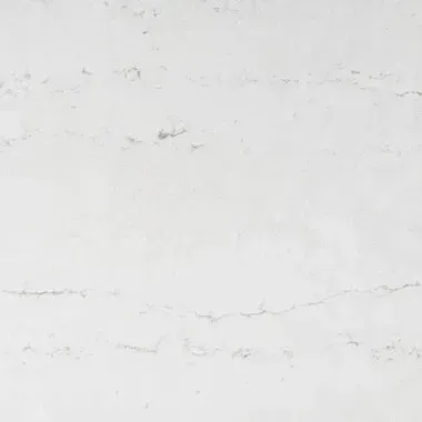 White marble-like surface with gray veining, suitable for kitchen or bathroom countertops.