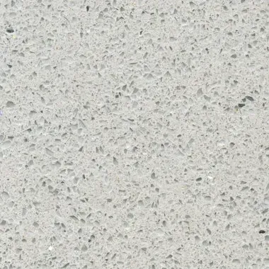 Light gray quartz countertop with flecked texture.