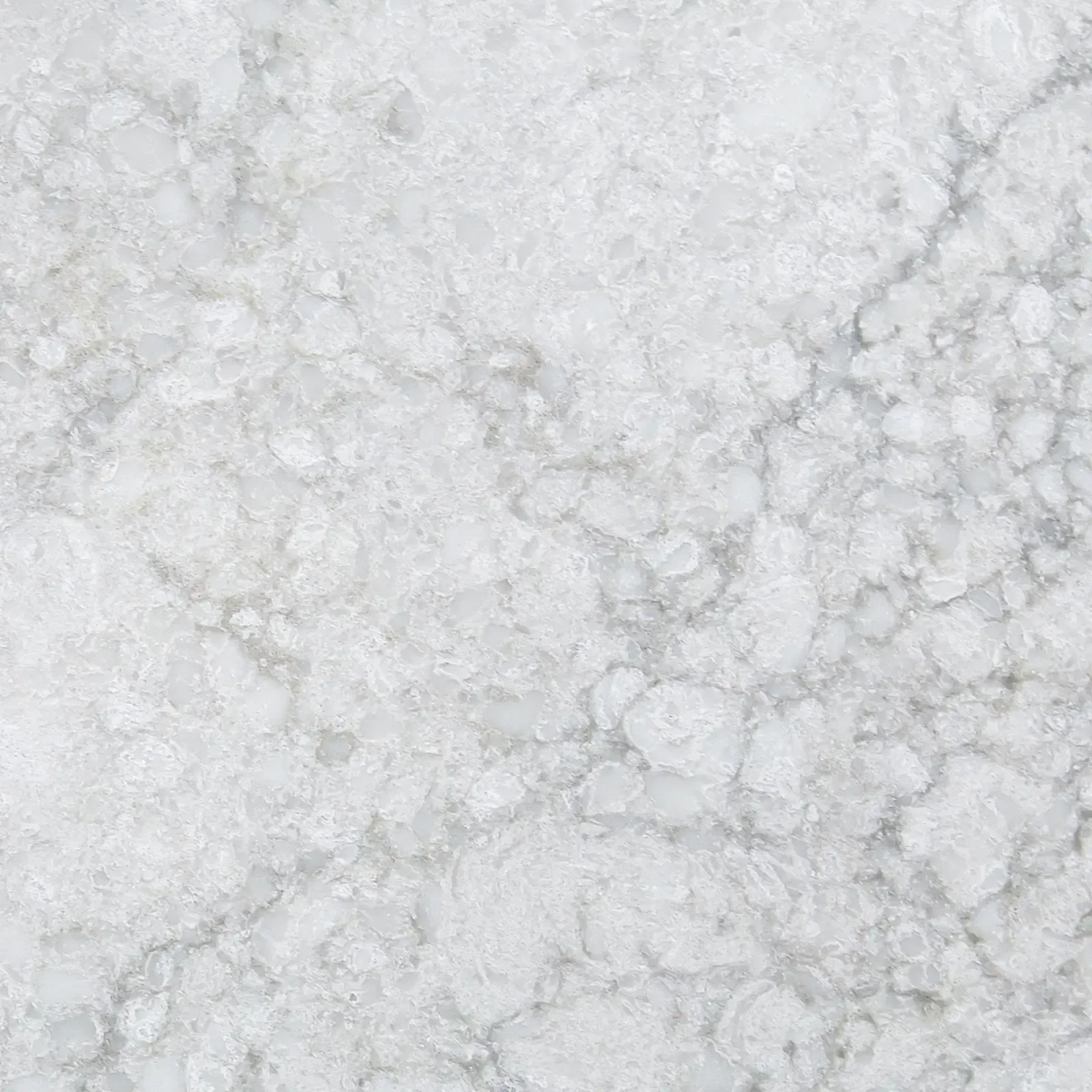 White, textured surface with subtle gray veining; resembling marble or stone.