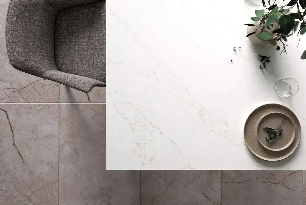 Overhead view of a modern dining table set with a chair, place settings, and decorations.