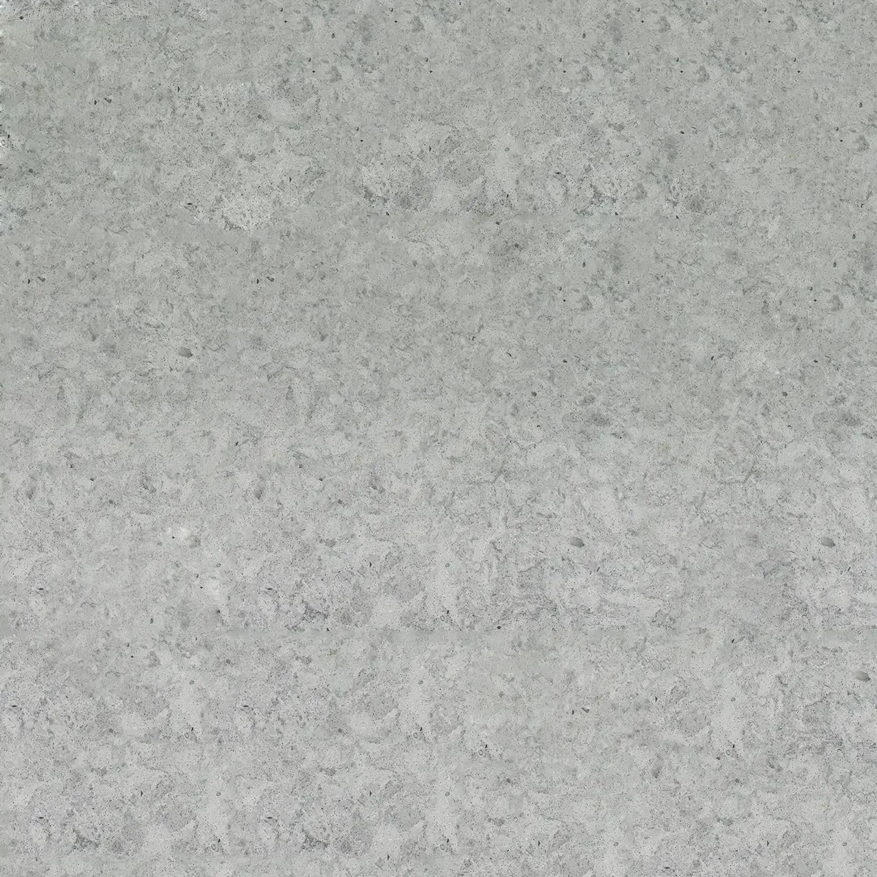 Light gray stone surface with subtle texture and horizontal striations.