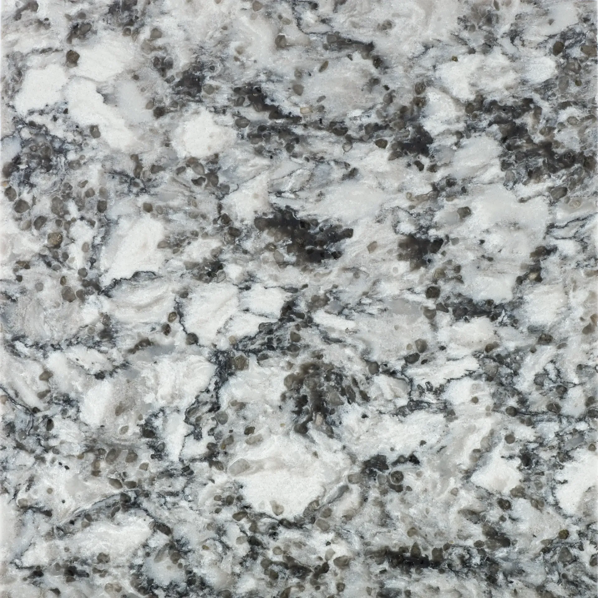 White and gray granite countertop with black speckles.