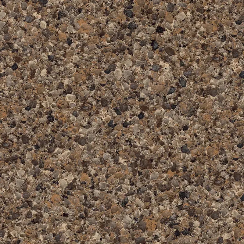 Close-up of a brown quartz countertop speckled with various-colored flecks.
