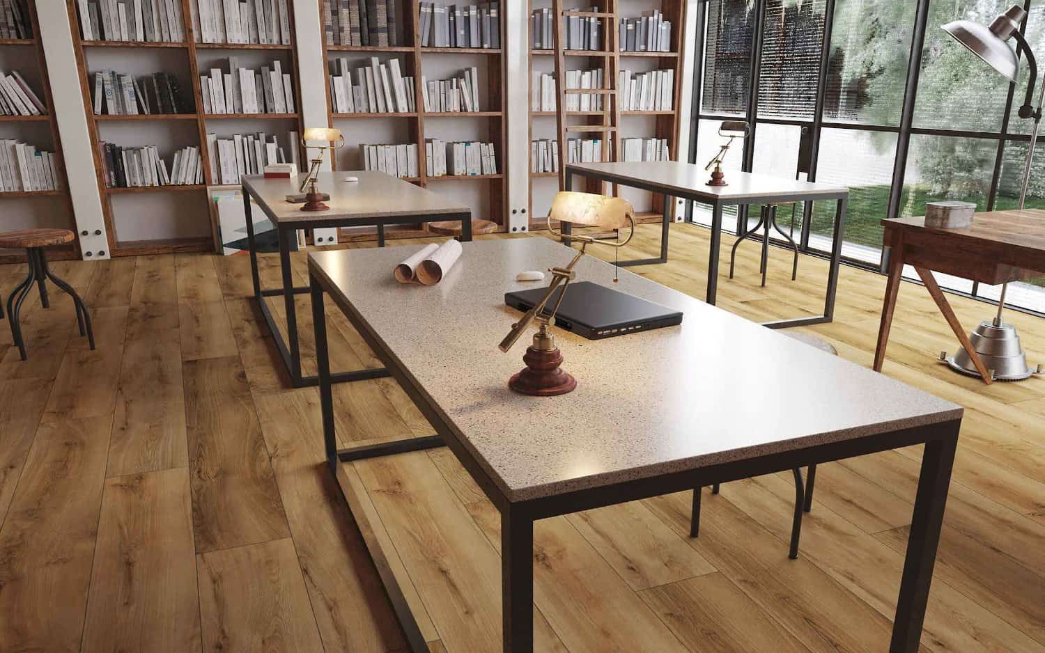 Library study area with desks, bookshelves, and large windows.