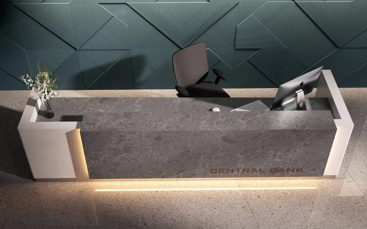 Gray marble reception desk with gold lettering and a geometric teal wall.