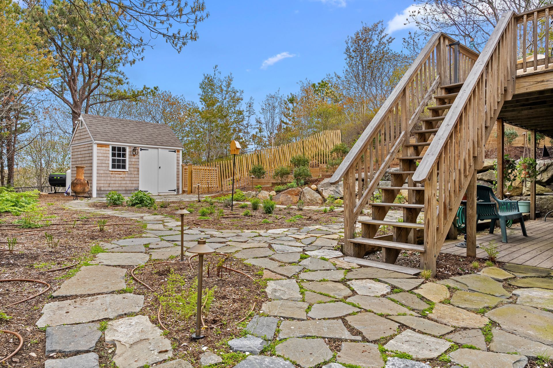 A wooden deck with stairs leading up to it