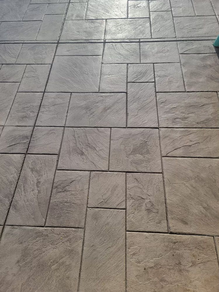 A close up of a tiled floor with a pattern