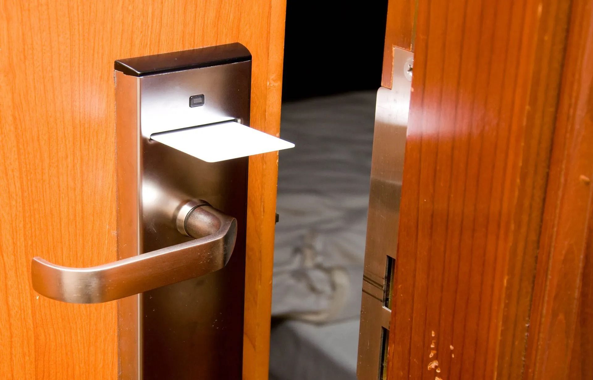 Door handle with a card inserted, unlocking a room.