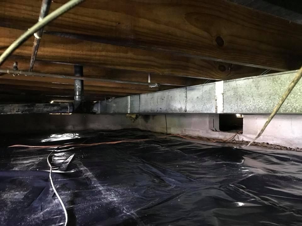 A picture of a crawl space under a house.