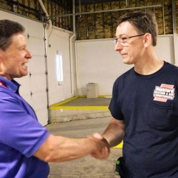 two men are shaking hands
