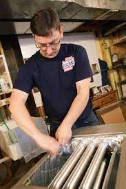 a man is working on a machine