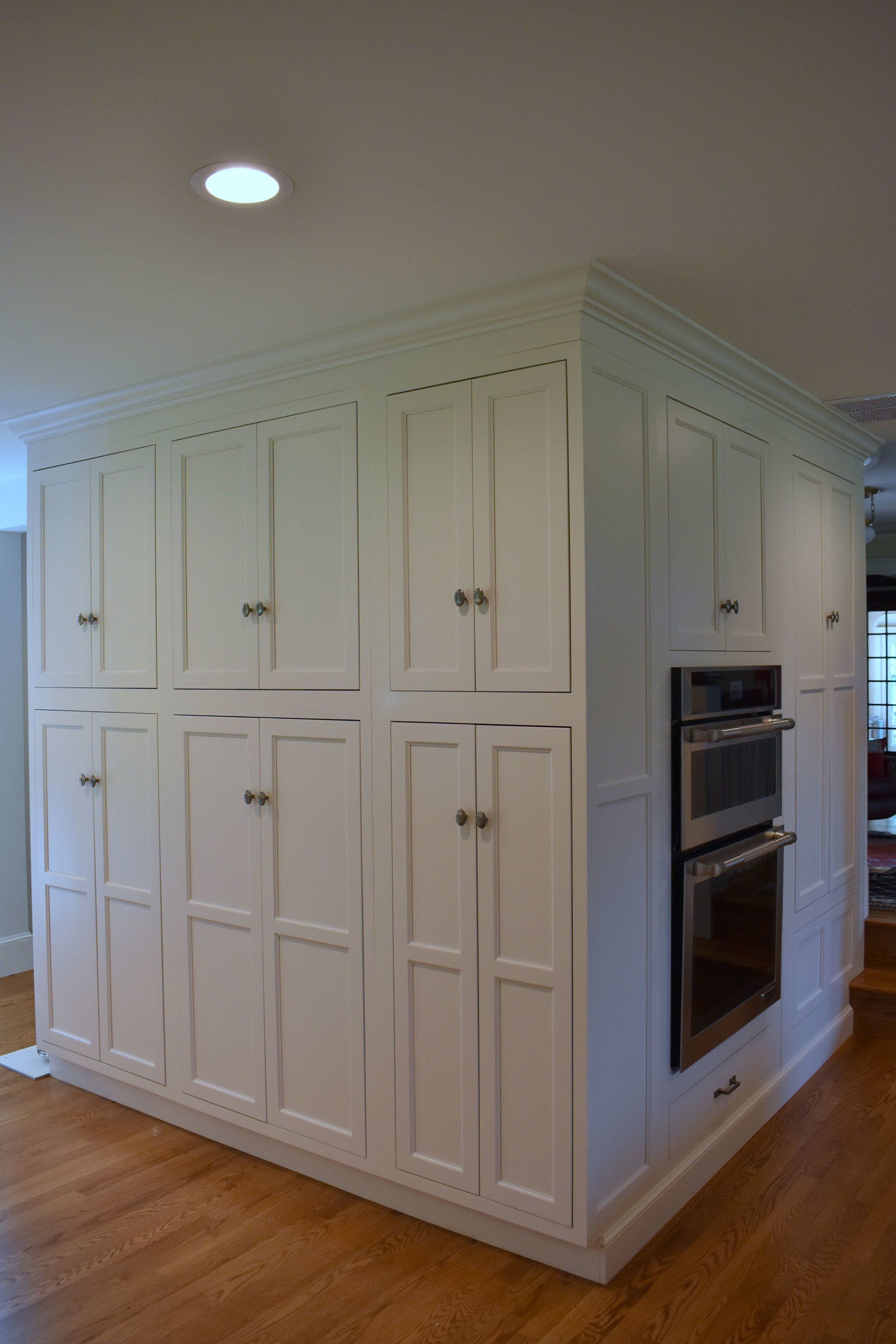white wall full of cabinets