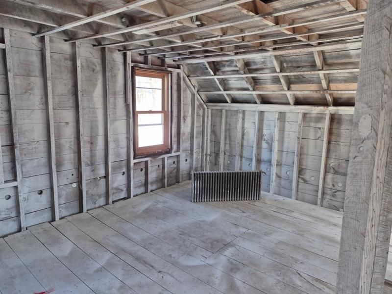 There is a radiator in the middle of the room.