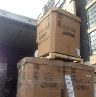 Two stacked cardboard shipping crates labeled 