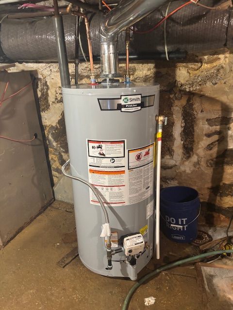 Gray water heater in a basement.