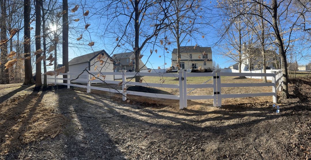 3 rail ranch rail with black wire and single gate.