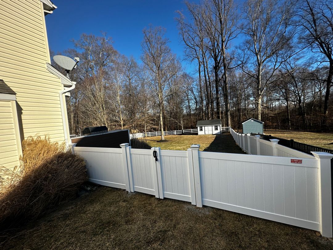 Privacy with double gate, solar caps on gate post.