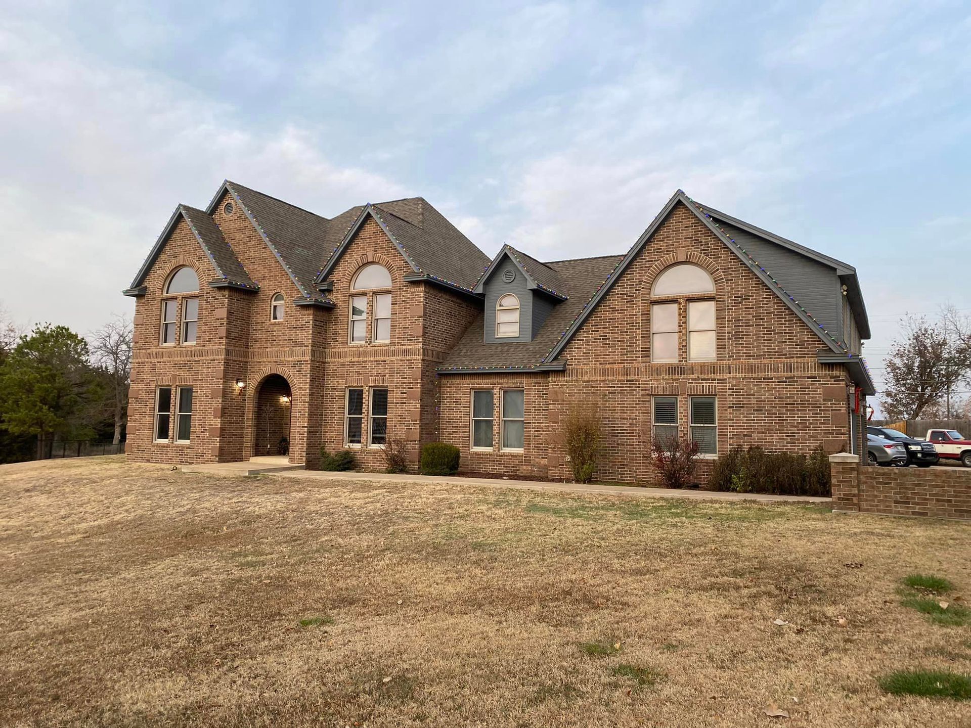 A large brick house with a lot of windows