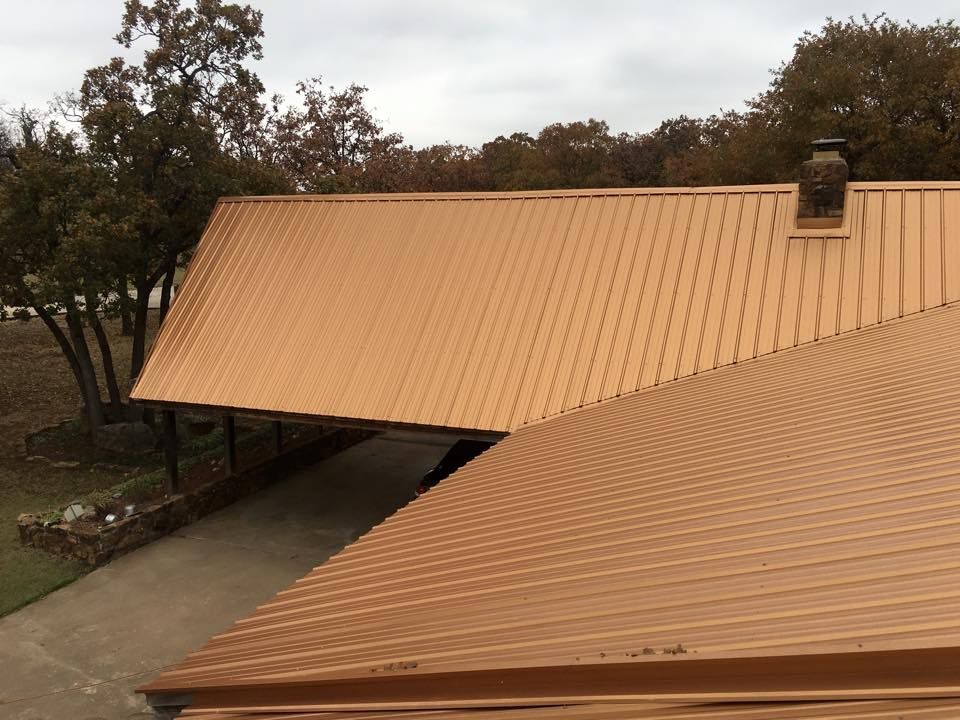 A brown roof with a chimney on top of it