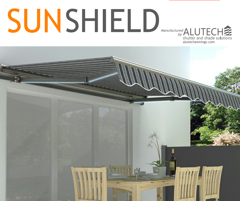 Modern patio with retractable striped awning over outdoor dining area, branded Sunshield Alutech