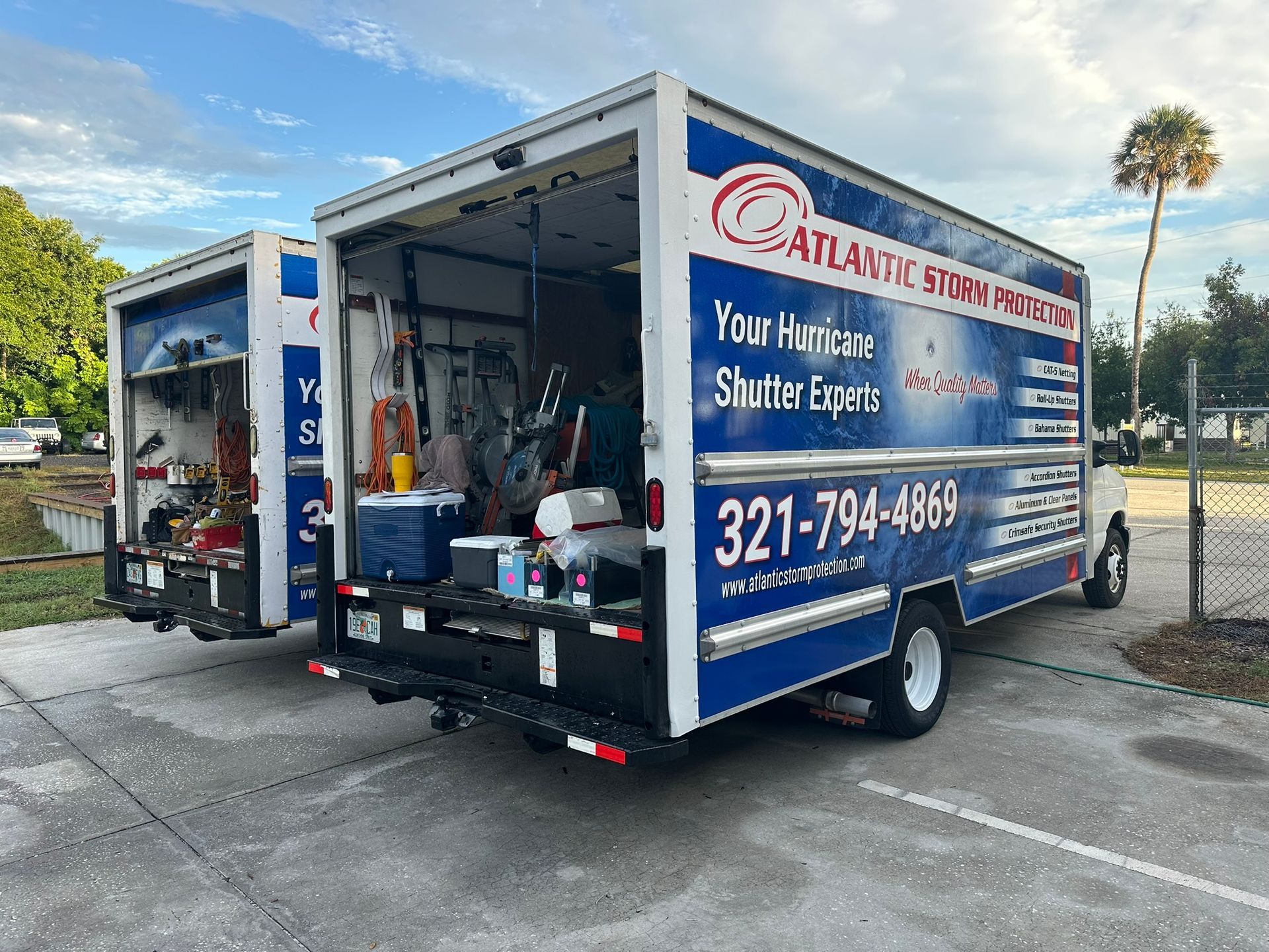 Blue Atlantic Steam Pro trailer with open rear door, cleaning equipment visible, parked outdoors