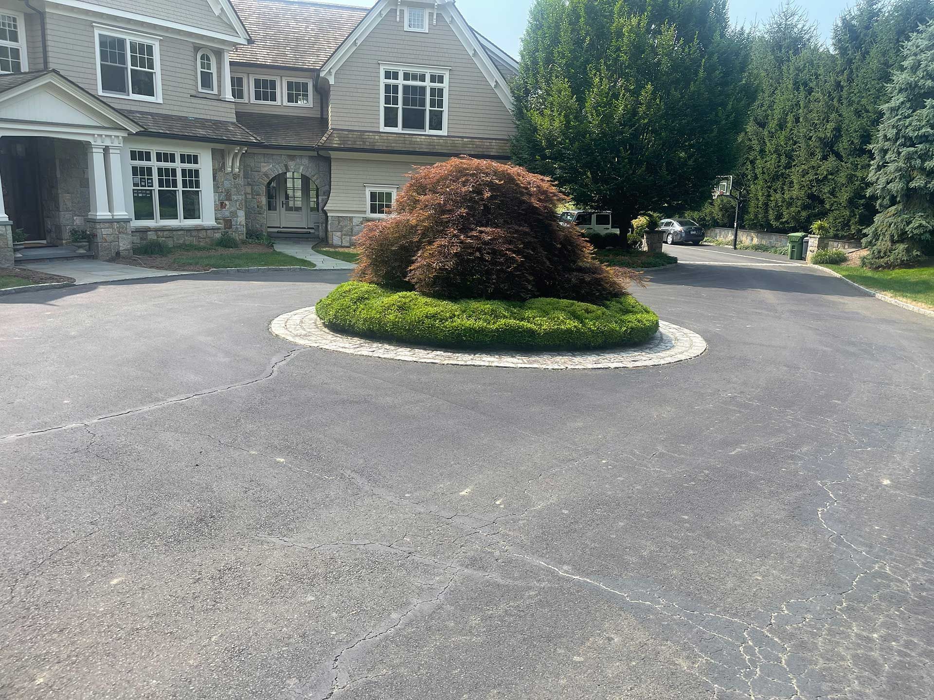 a large house with a circular driveway in front of it